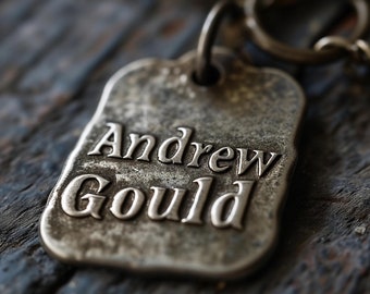 dog tag with the name "Andrew Gould" embossed on it