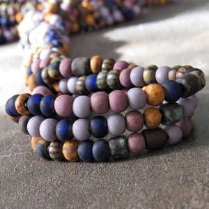 Matte Plum Blossom Czech Glass Striped Tube Picasso Seed Bead 6/0 Mix:  10 Inch Strand 6/0 Aged Picasso Mix