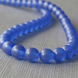 Perles en verre tchèque dorées suédées saphir 6 mm Druk : 50 pièces saphir dorées 6 mm Druk