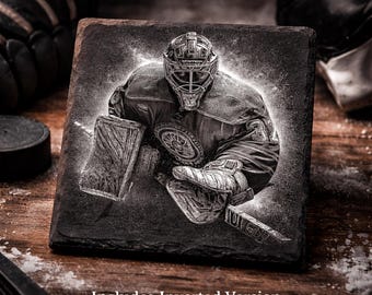 May include: Square slate coaster with a detailed engraving of a hockey goalie in action. The image is in black and white, with the text "Slate Ready Engraving PNG" and "Includes Inverted Version". The coaster is on a wooden surface.