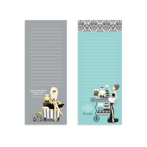 May include: Two gray and blue lined notepad sets with illustrations of women and quotes. The gray notepad features a woman in a black dress holding a gift box and the quote "Never choose between two good things... Take 'em both!" The blue notepad features a woman in a black dress holding a glass of champagne and a dessert cart with the quote "Life is uncertain. Eat dessert first."