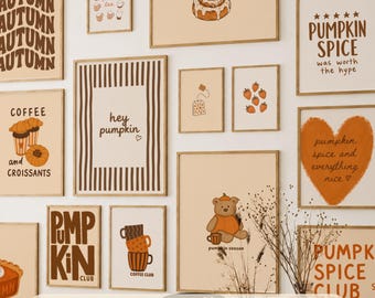 May include: A collection of fifteen wall art prints featuring autumn-themed illustrations including cinnamon rolls, coffee, pumpkins, and bears in warm brown and orange tones with text such as "hey pumpkin," "pumpkin spice," and "coffee club."