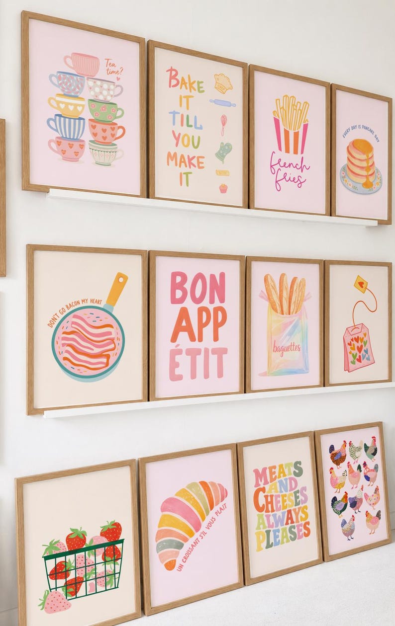 May include: A collection of framed art prints with a food theme. The prints feature illustrations of tea cups, bacon, French fries, pancakes, strawberries, croissants, baguettes, and chickens. Text includes "Tea time?", "Bake it till you make it", "French fries", "Bon app&eacute;tit", and "Meats and cheeses always pleases".