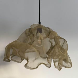 Neutral-tone hanging light fixture, blending seamlessly with minimalist home decor.