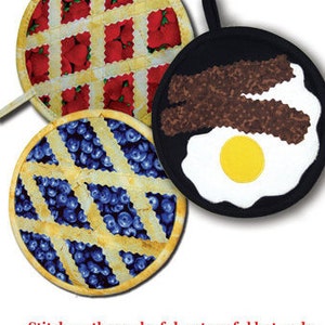 May include: Three round pot holders with different designs. One has a red and white checkered pattern with red berries, another has a blue and white checkered pattern with blue berries, and the last one is black with a brown bacon and white egg design.