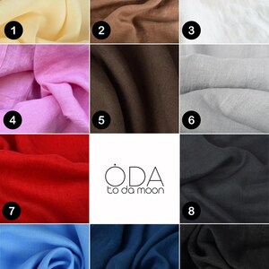 May include: Eleven fabric swatches in a range of colours are displayed. The colours include pale yellow, brown, white, pink, dark brown, light grey, red, black, blue, dark blue, and black. The logo "ODA to da moon" is also visible.