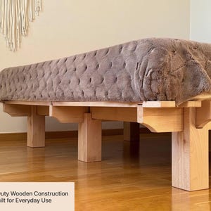 Solid beech wood bed frame with heavy-duty wooden construction and minimalist design