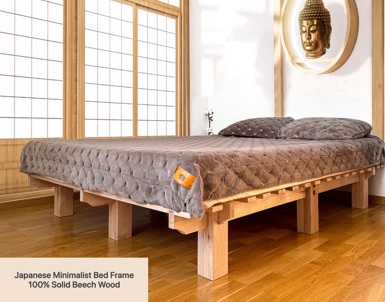Handmade solid beech wood platform bed with Japanese-inspired design in a bright minimalist bedroom