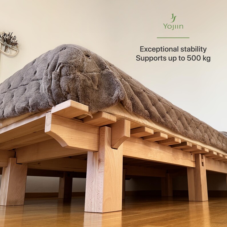 Handmade Japanese platform bed made from solid beech wood, showing stable wooden construction and heavy-duty support