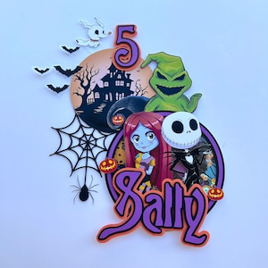 May include: A purple and orange cake topper featuring characters from the Nightmare Before Christmas. The topper includes Jack Skellington, Sally, and Zero. The text "Sally" is written in a large, stylized font. The number "5" is also included in the design.