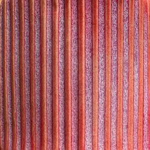 May include: Close-up of a textured surface with vertical stripes. The stripes alternate between shades of red, orange, and purple, creating a visually dynamic pattern. The texture appears to be slightly raised, adding depth.