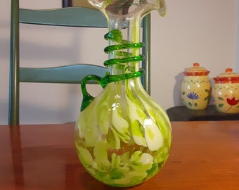 Handblown green vine-wrapped art glass vase.