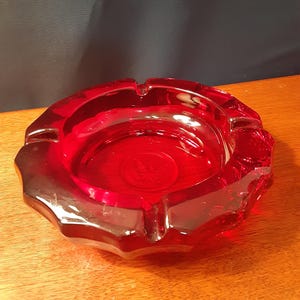Vintage Fostoria Glass ruby heavy glass Eagle coin ashtray. 5.25" at rim. Excellent condition.