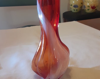 Beautiful hand-blown deep orange/white swirl glass vase in excellent condition. Unique and interesting little art piece.