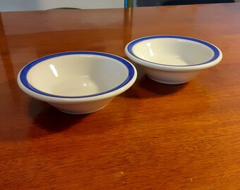 2 Buffalo China vintage ceramic dipping bowls. Superb quality white with striking blue rim. Company imprinted. Mint cond. Sold as pair.