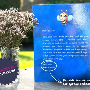 May include: Blue book with a dedication on the back cover. The dedication reads "Dear Tristan, This book was made just for you! As you explore the wonders of nature, you'll meet new friends and discover amazing things all around you. Every page is a special adventure designed to help you learn about the world in a fun and exciting way. I hope these stories inspire your imagination and fill your heart with joy! With love, Auntie Nicole".
