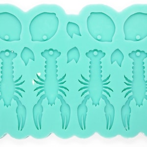Può includere: Uno stampo in silicone turchese con quattro forme di aragosta e tre forme di limone. Lo stampo è progettato per realizzare oggetti in resina.