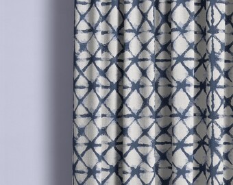 May include: Blue and white patterned fabric with a geometric design. The fabric has a subtle tie-dye effect.