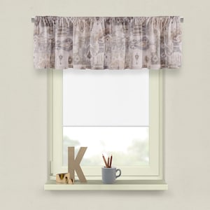 May include: A window valance with a neutral-toned, patterned fabric is mounted above a white window shade. The valance features a design in shades of beige, gray, and brown. A shelf below the window holds decorative items, including a wooden letter "K" and a small mug with pencils.