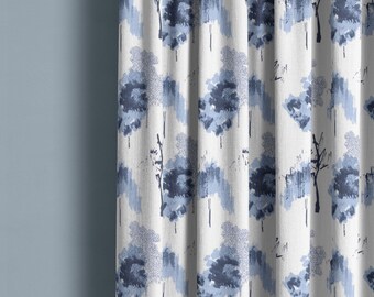 May include: White curtain with a repeating pattern of blue abstract trees and brushstrokes. The design features varying shades of blue, creating a textured, artistic look. The curtain is hanging in front of a light blue wall.