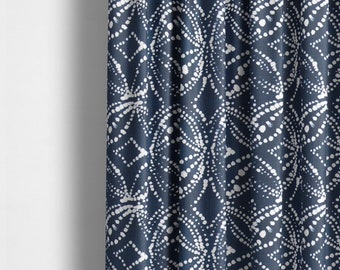 May include: A navy blue curtain with a white geometric pattern of circles and dots. The pattern is repeated throughout the fabric.