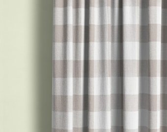 May include: A close-up of a white and gray gingham curtain with a subtle texture. The curtain is made of a soft, woven fabric and has a relaxed, casual look.