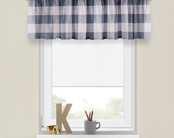 May include: A white window with a white valance featuring a black and white gingham pattern. The window is decorated with a wooden letter K, a cup with pencils, and a gold ring.