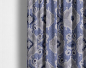 May include: Blue and white patterned fabric curtain with a subtle ikat design. The fabric has a textured, woven look.