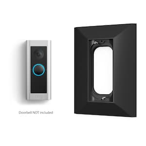 May include: A black doorbell camera mount with a silver doorbell camera, the text "ring" is visible on the camera. Doorbell NOT included.