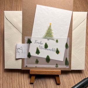 selbsthergestellte kreative Weihnachtskarte mit genähten Rand