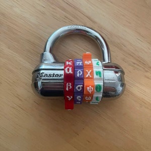 May include: A silver combination padlock with colored dials displaying Greek letters. The word "Master" is printed on the lock's body, and "HARDENED" is printed on the shackle. The dials are red, purple, orange, and green.