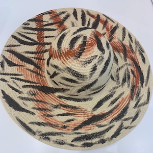 Exclusive splash painted natural tone floppy hat.