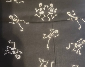 Skeletons on black cotton fabric