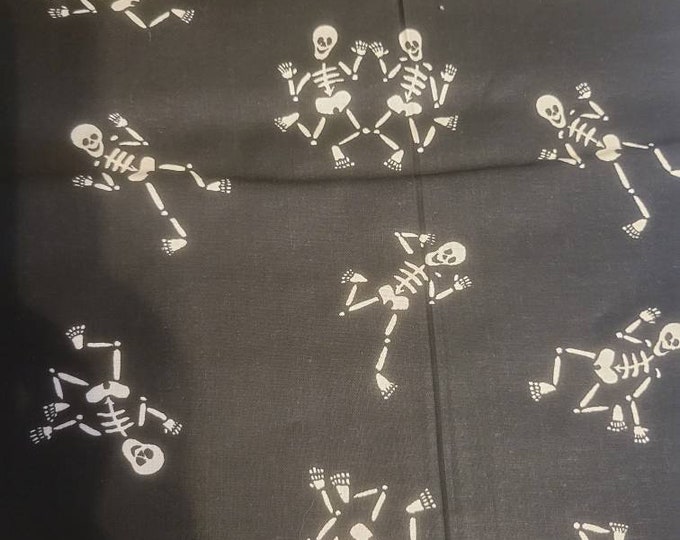 Skeletons on black cotton fabric