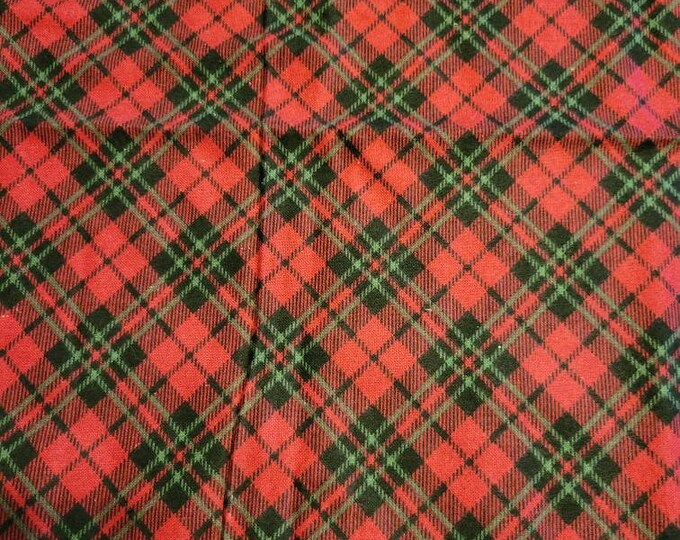 Red plaid light weight flannel fabric.  Only 23" left
