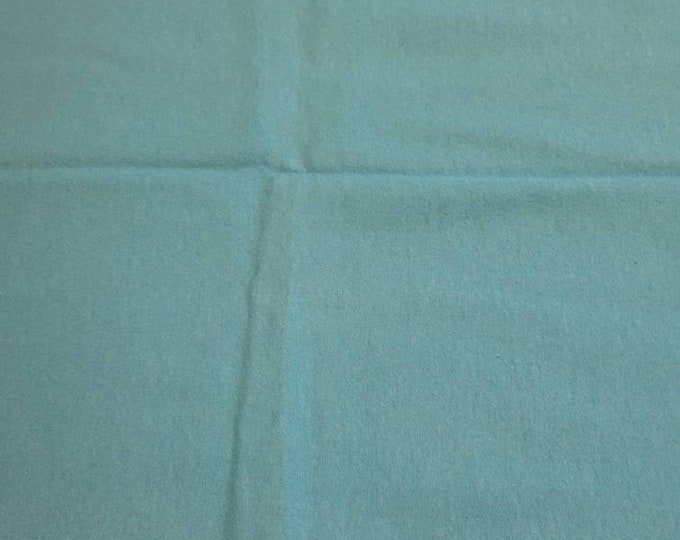 Turquoise blue light weight flannel fabric.  Only one yard left