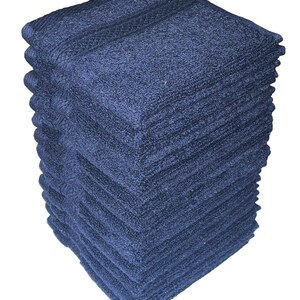 May include: A stack of 12 dark blue hand towels. The towels are folded and stacked neatly.