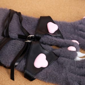 Furry Paw Gloves with Adjustable Straps, Ideal for Anime & Fursuit Cosplay – Designed for anime lovers, fursuit makers, and costume enthusiasts, these plush furry gloves feature squishy silicone pads and sharp-looking 3D-printed claws for a beastly aesthetic. The soft material provides comfort, while the adjustable straps ensure a secure fit. Ideal for furry conventions, cosplay events, and photography sessions. Available in black, white, gray, and pink.