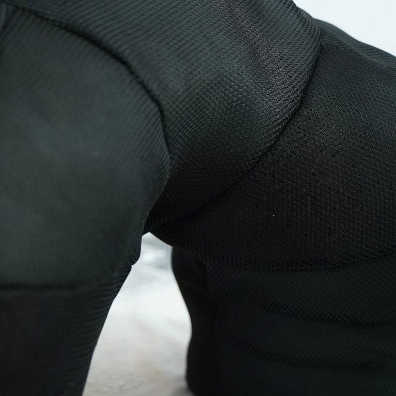May include: Black padded athletic shorts with a mesh design.