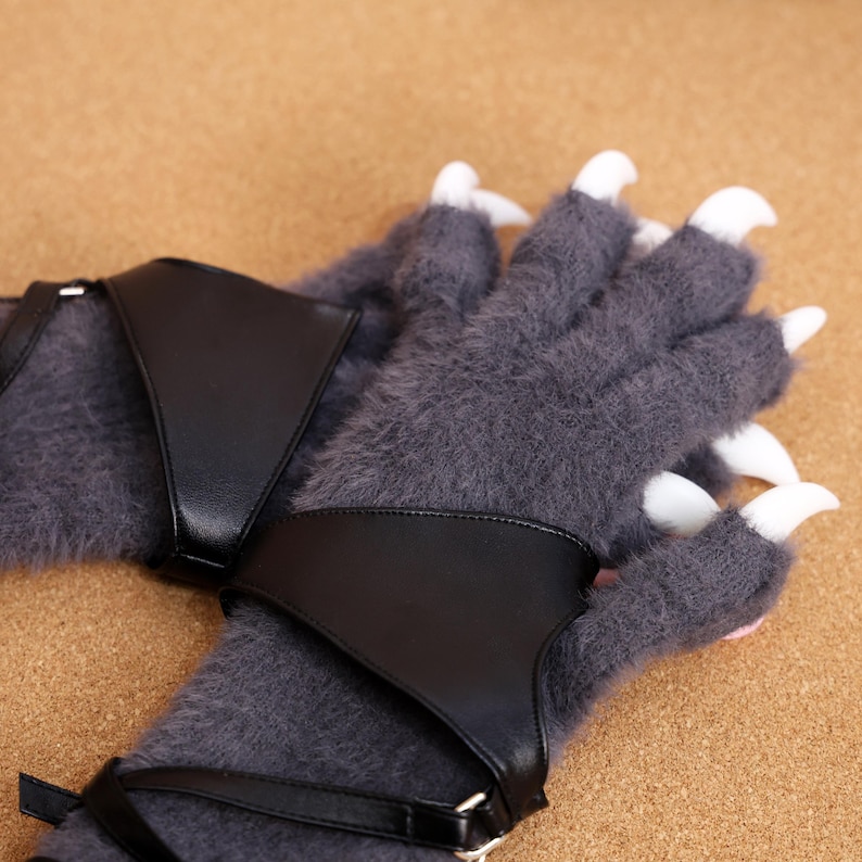High-Quality Furry Paw Gloves with Realistic Claws, Ideal for Cosplay & Photography – These detailed furry beast gloves add authenticity to any cosplay or fursuit. Featuring ultra-soft plush fabric, sharp-looking 3D-printed claws, and silicone pads, they provide a highly realistic appearance and feel. Ideal for conventions, photo shoots, and performances, they enhance your costume with premium craftsmanship. Comfortable and adjustable to fit most hand sizes.