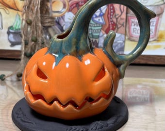 Pumpkin Candle Holder on Tombstone Base — Handmade Ceramic Halloween Decor, Tea-light Jack-o’-Lantern