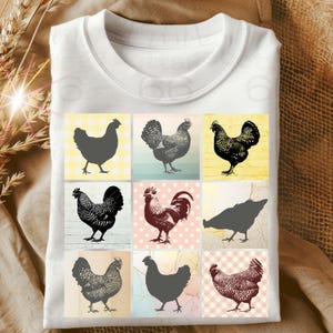 May include: A white t-shirt with a black and white graphic design of nine chickens in different poses. The chickens are arranged in a grid pattern on the shirt.