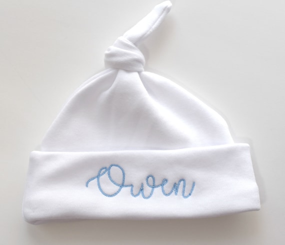 white knotted baby hat