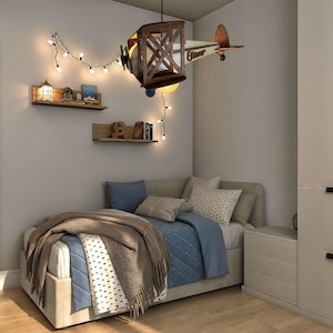 Natural wood airplane lamp hanging in child bedroom, wooden aviation nursery decor with warm pendant light