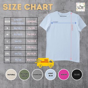 May include: Size chart for a t-shirt with measurements in inches and centimeters. The chart shows chest and length measurements for sizes S, M, L, XL, 2XL, and 3XL. The t-shirt is light blue and has a crew neck.
