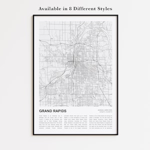 May include: A framed monochrome map print of Grand Rapids, Michigan, USA. The map details the city's road network and rivers. Text at the top says "Available in 8 Different Styles". The city name and description are at the bottom.