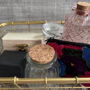 gold tone metal basket and six small containers for opening and closing practical life montessori lessons ages 2-6 children&#39;s house