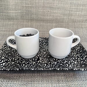 Black and White Theme Pouring Materials for Practical Life Lessons in a Montessori Children&#39;s House Classroom with White Mini Mugs