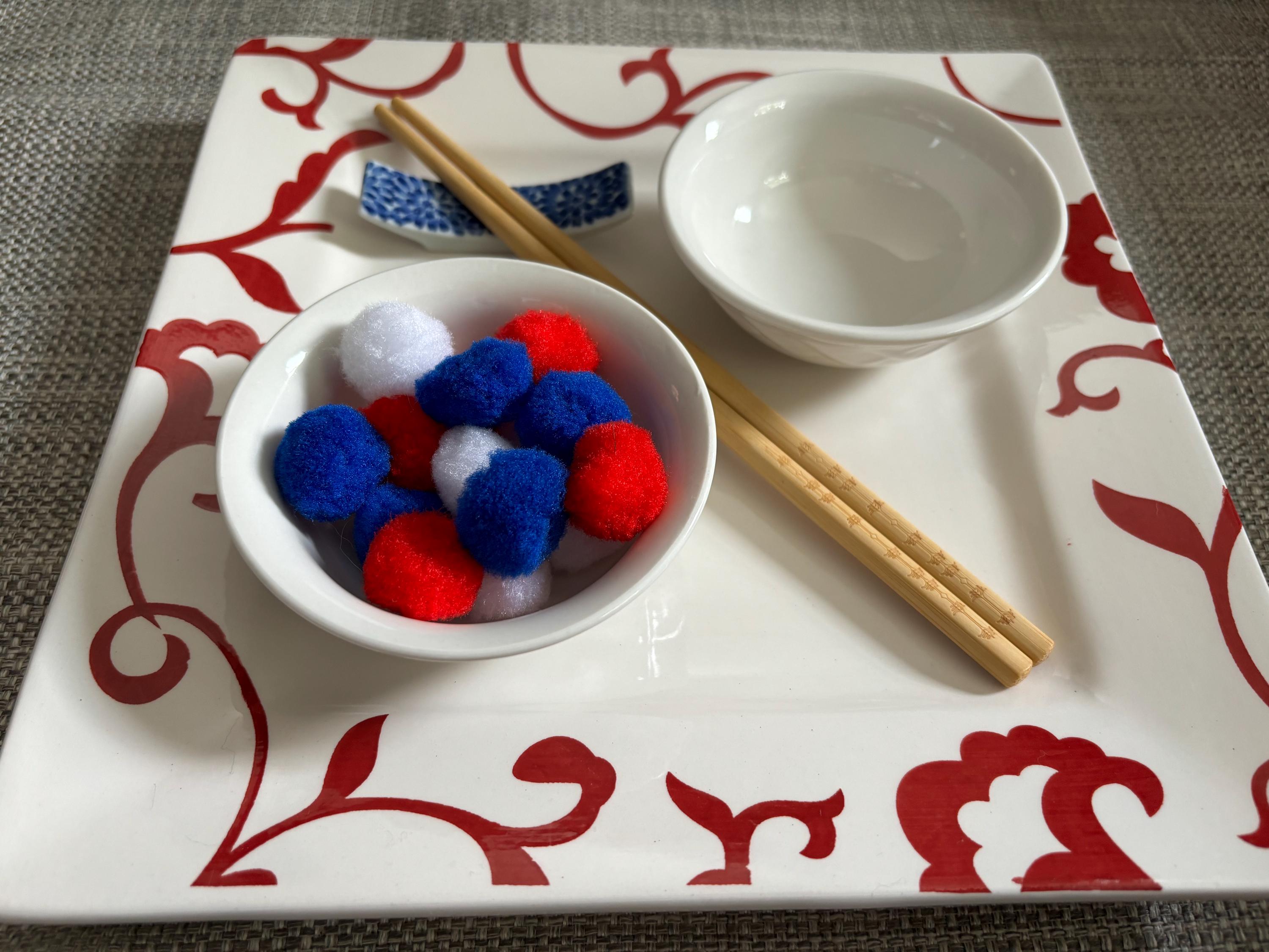 Montessori Method Inspired Tonging Extension Materials Red White and Blue with Chopsticks, Craft Poms, and Ceramic Bowls for Practical Life