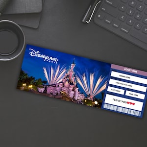 May include: A blue and white ticket with the words "DISNEYLAND PARIS" and "ADMIT ONE" printed on it. The ticket has a picture of the Disneyland Paris castle with fireworks in the background. The ticket also has the words "NAME HERE", "DESTINATION HERE", "DATE HERE", "TIME HERE", and "I LOVE YOU" printed on it.